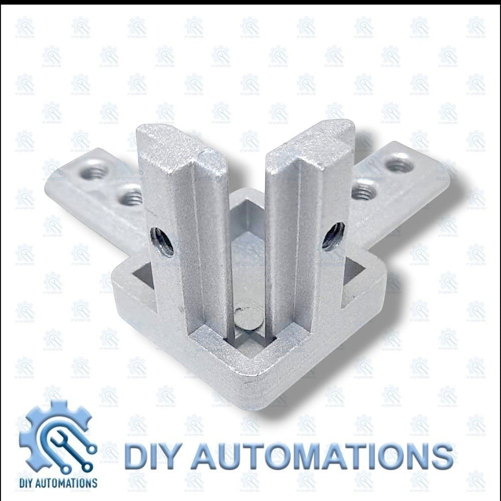 DIY AUTOMATIONS silver aluminum 3-way corner connector bracket for 20mm extrusions. Robust and durable.