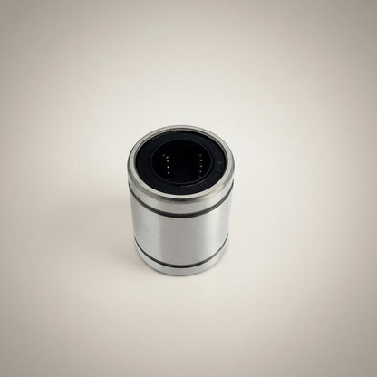 DIY AUTOMATION LM 25UU linear bearing, silver metal exterior with black interior and visible ball bearings for smooth motion.