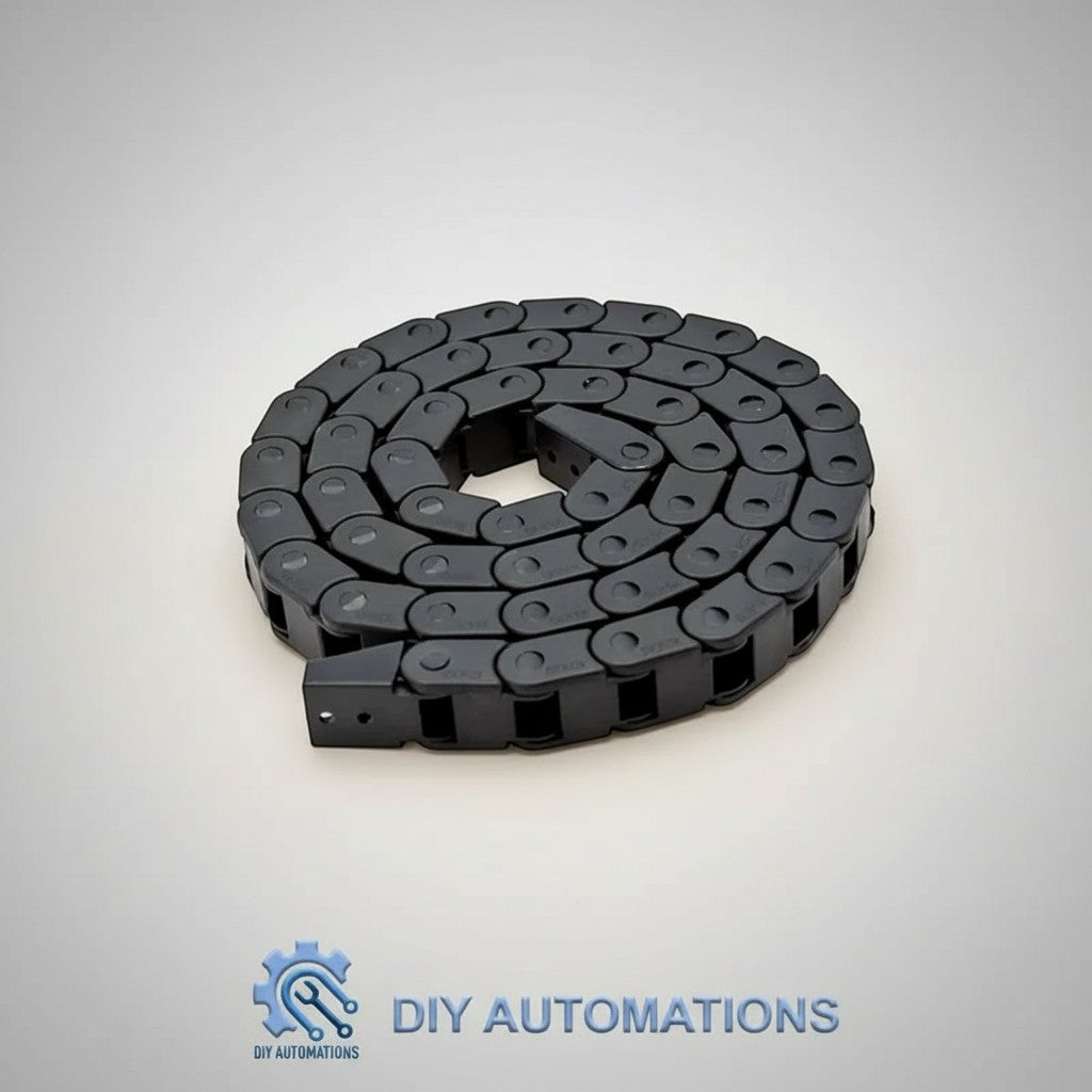 DIY Automations black plastic industrial drag chain cable carrier for robotics and CNC machines, coiled on a light grey background.